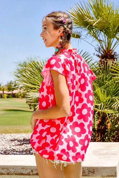 Pink BiBi Floral Contrast Ruffled Top by Trendsi with ruffled sleeves and floral pattern, styled on a mannequin.