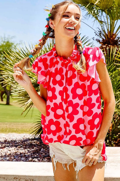 Pink BiBi Floral Contrast Ruffled Top from Trendsi featuring ruffled edges and floral print, perfect for a stylish, feminine look.
