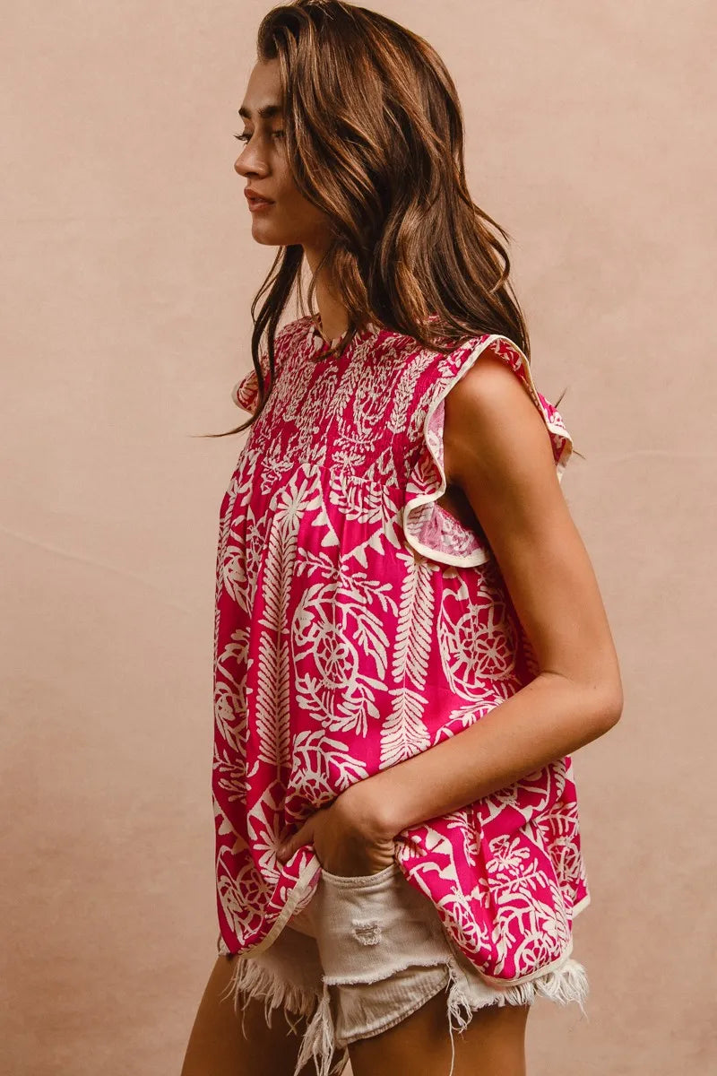 Pink BiBi printed ruffle sleeve top by Trendsi, featuring a stylish design and lightweight fabric, perfect for casual or dressy wear.