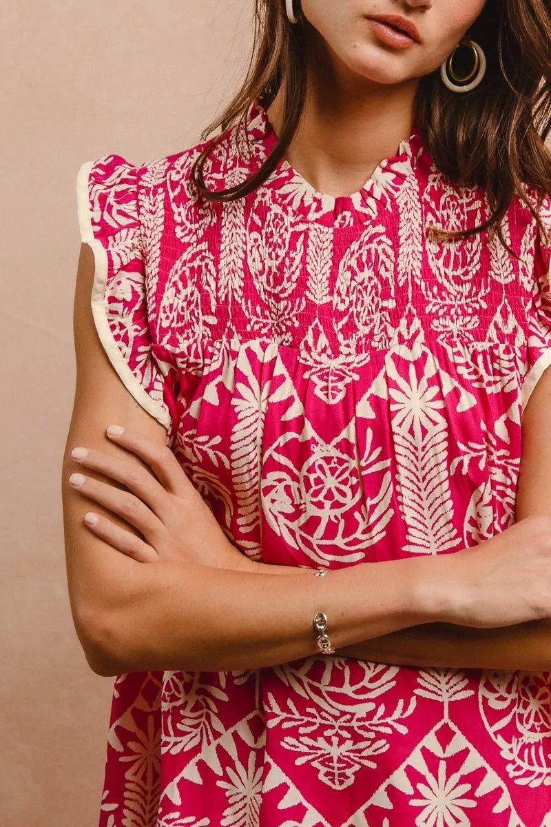 Pink BiBi printed ruffle sleeve top from Trendsi featuring a stylish design and feminine ruffle details.