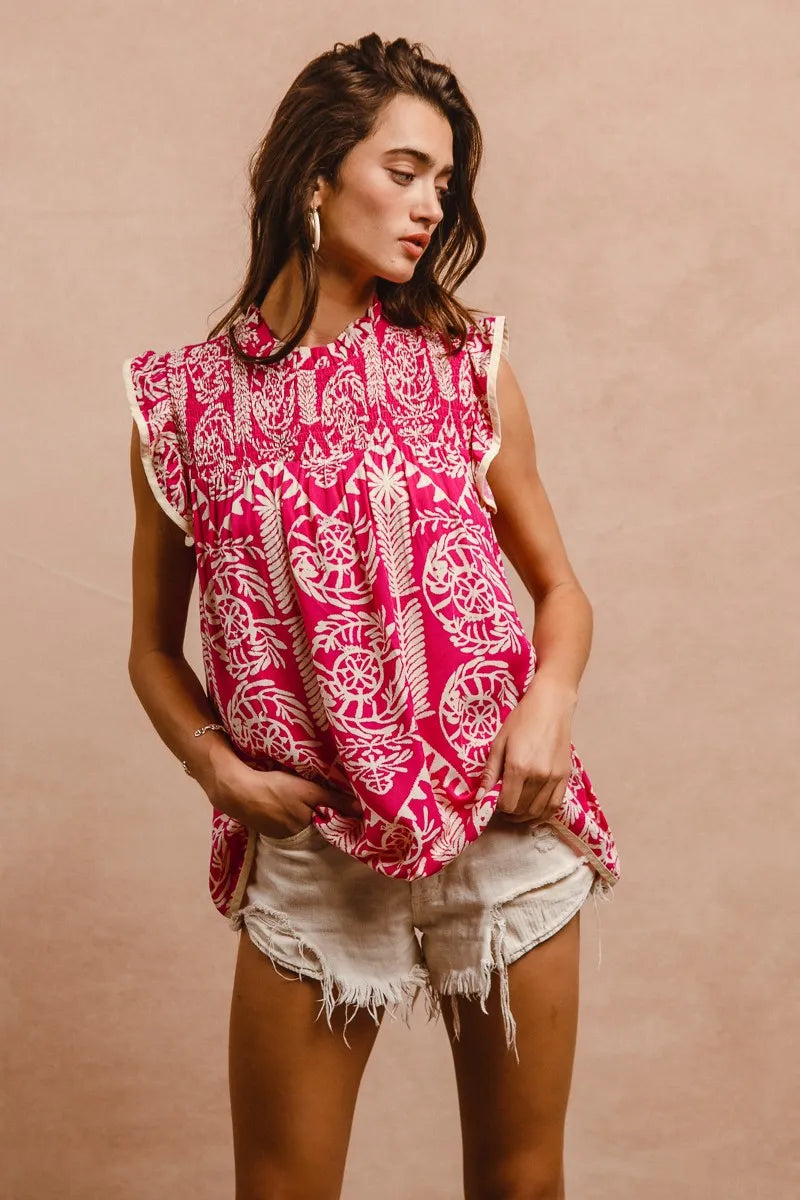 Pink BiBi printed ruffle sleeve top from Trendsi, featuring a feminine design with ruffled sleeves and a stylish pattern.