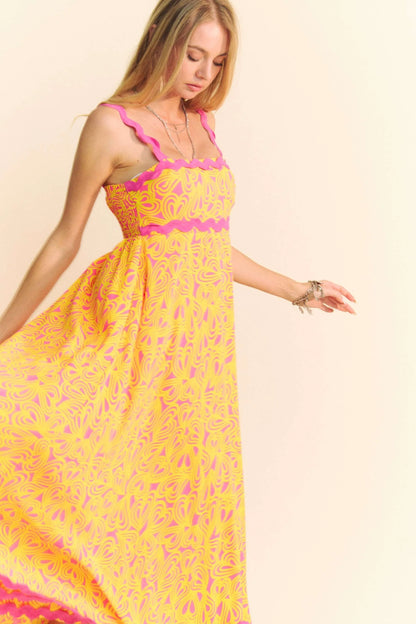 Pink Davi & Dani Geo 2 Tone Printed Wavi Trim Tiered Maxi Dress with flowing silhouette and vibrant pattern.