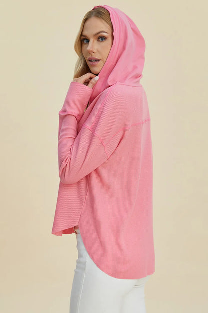 Pink Trendsi Double Take full-size high-low dropped shoulder long sleeve hoodie shown on a model.