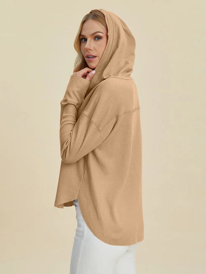 Pink Trendsi Double Take full-size high-low dropped shoulder long sleeve hoodie, casual and comfortable, shown on a model.