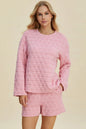 Pink double take texture round neck long sleeve top and shorts set by Trendsi, casual two-piece outfit with comfortable fit.