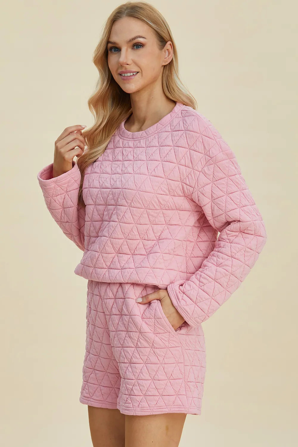 Pink Trendsi Double Take texture long sleeve top and shorts set, featuring a round neck and comfortable fit.