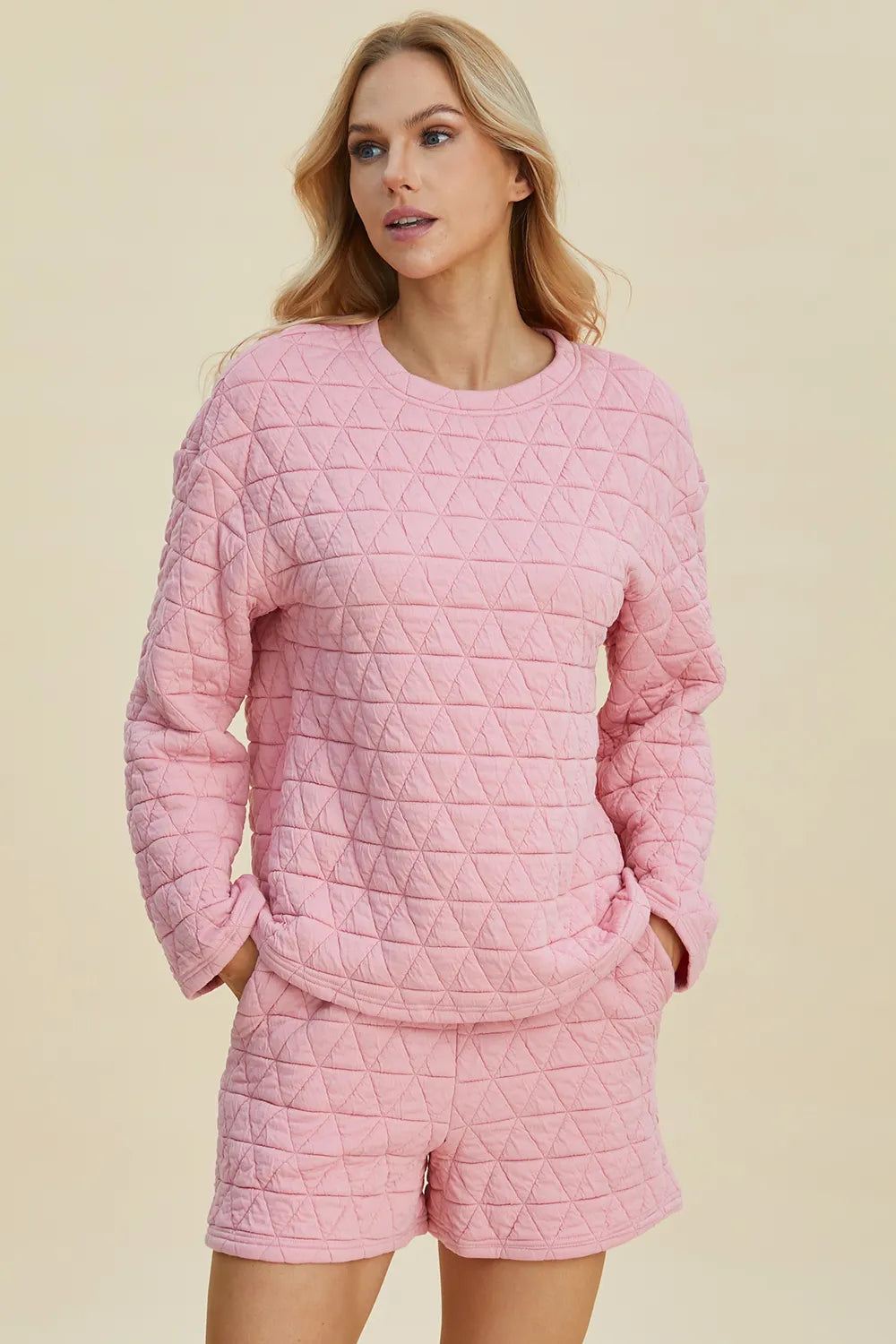 Pink double take full-size texture long sleeve top and shorts set by Trendsi, featuring a round neck and casual style.
