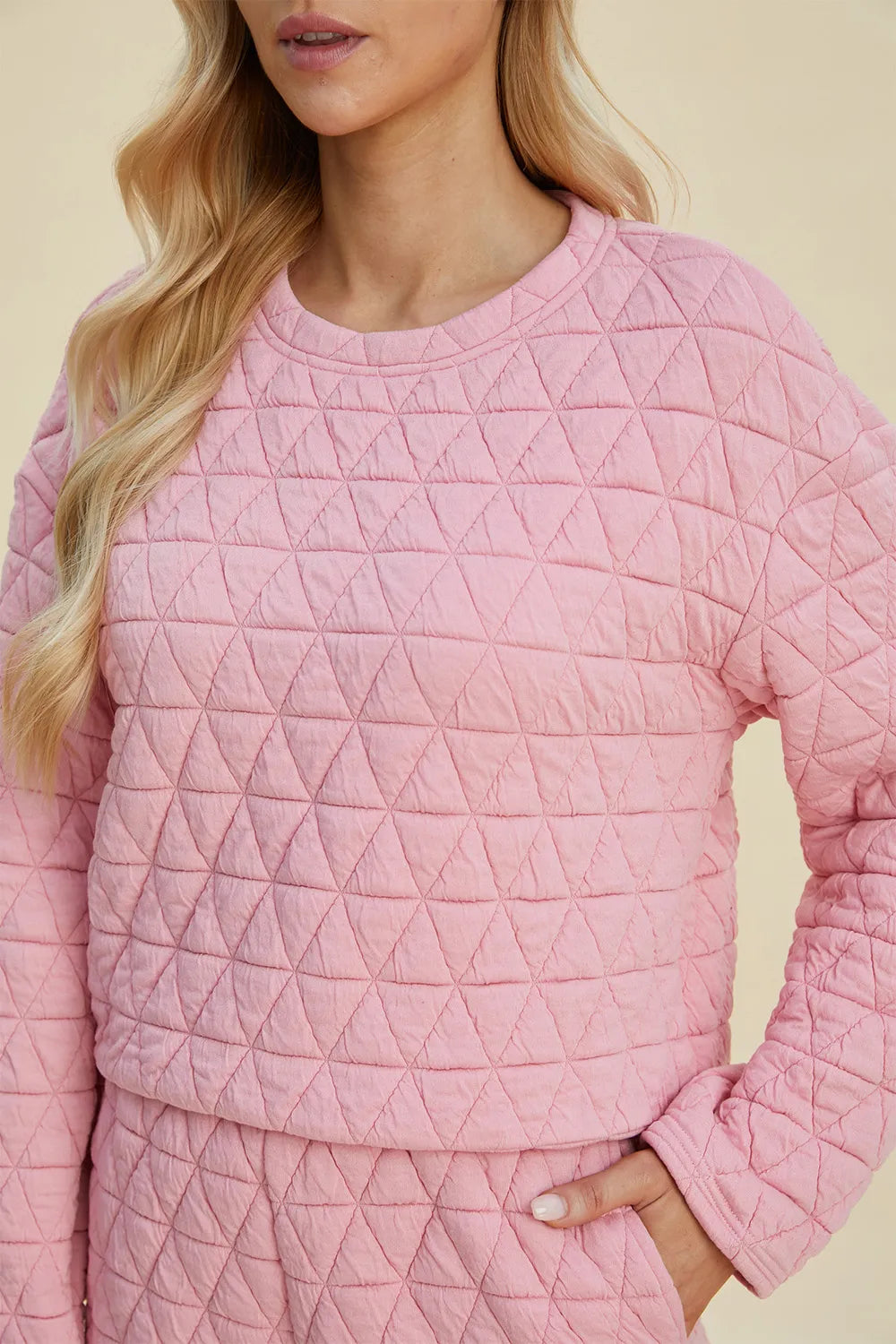 Pink textured full-size long sleeve top and shorts set by Trendsi, featuring a round neck and casual comfortable fit.