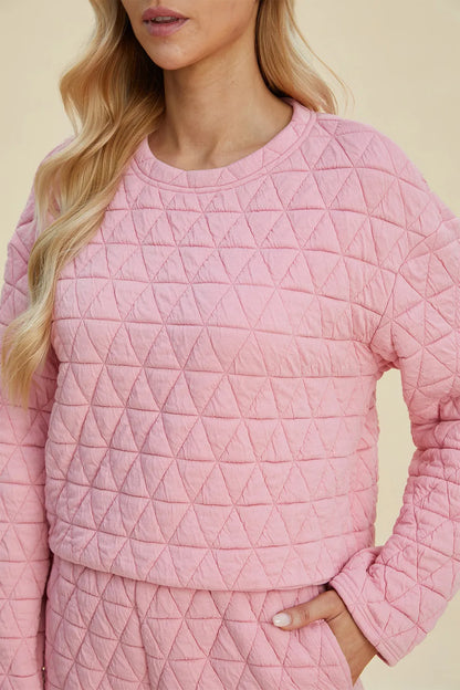 Pink textured full-size long sleeve top and shorts set by Trendsi, featuring a round neck and casual comfortable fit.