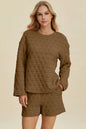 Pink textured round neck long sleeve top and matching shorts set from Trendsi, comfortable and stylish for casual wear.