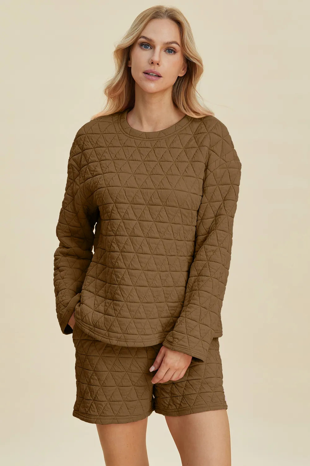 Pink textured long sleeve top and shorts set by Trendsi featuring a round neck and casual, comfortable design.