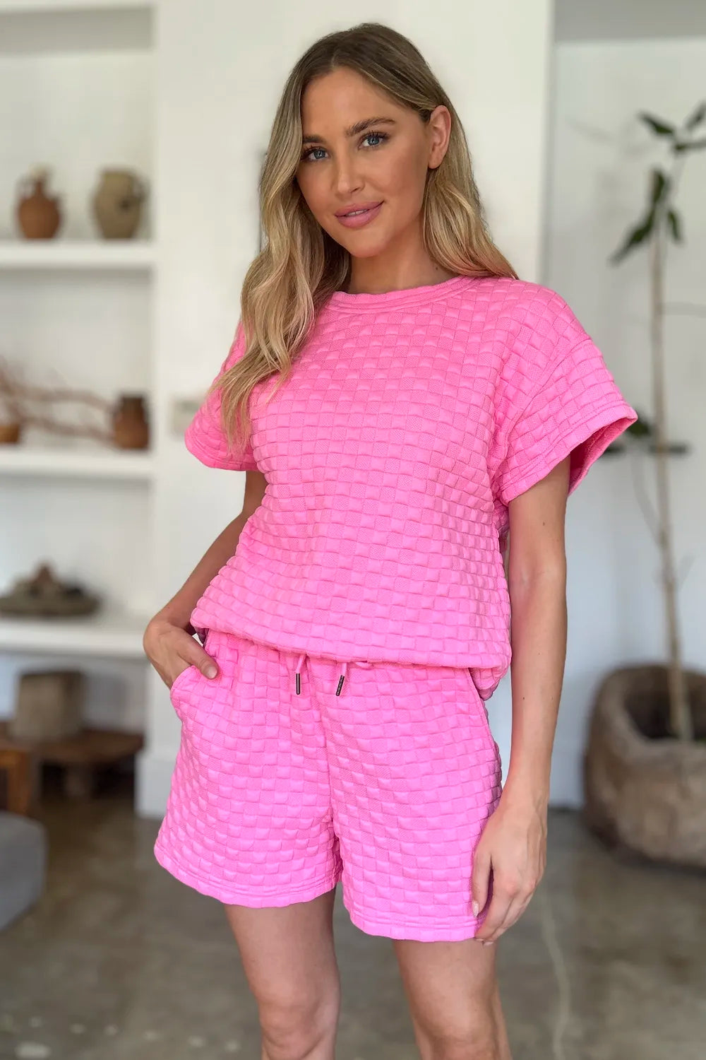 Pink full-size texture T-shirt and shorts set by Trendsi, featuring a comfortable casual style and soft fabric.
