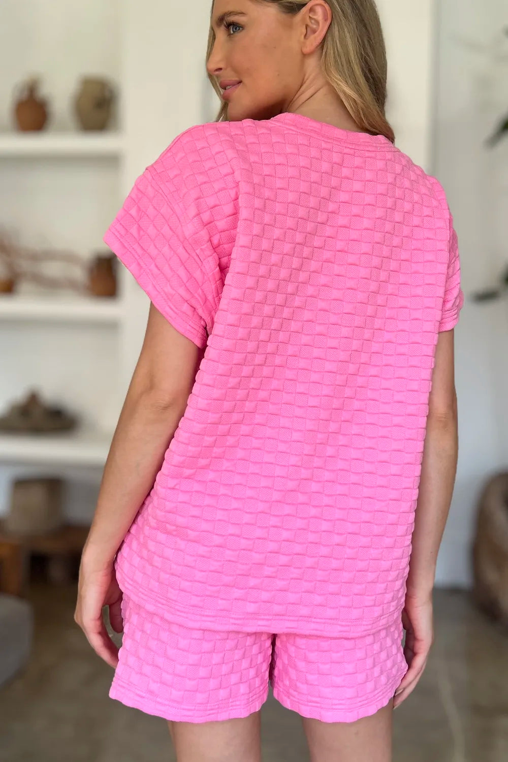 Pink double take full-size texture T-shirt and shorts set by Trendsi, featuring a comfortable casual outfit.