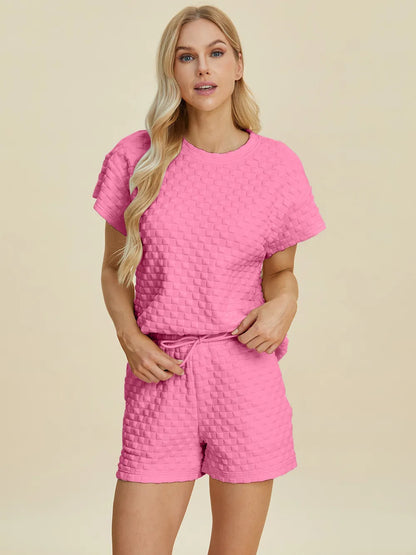 Pink double take full size texture T-shirt and shorts set by Trendsi, casual loungewear with a textured fabric design.