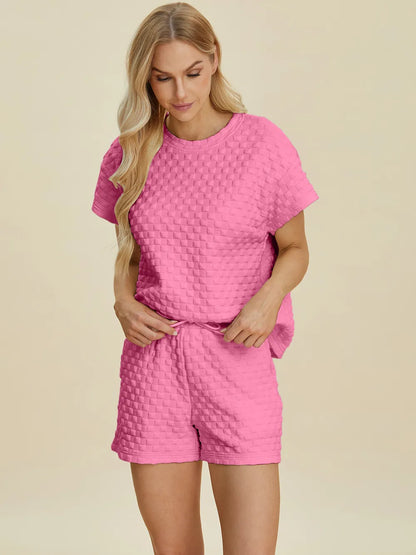 Pink double take full size texture t-shirt and shorts set by Trendsi, casual outfit with matching top and shorts.