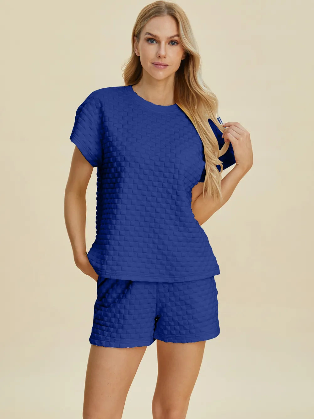 Pink Double Take full-size texture T-shirt and shorts set by Trendsi, featuring a comfortable fit and stylish design.