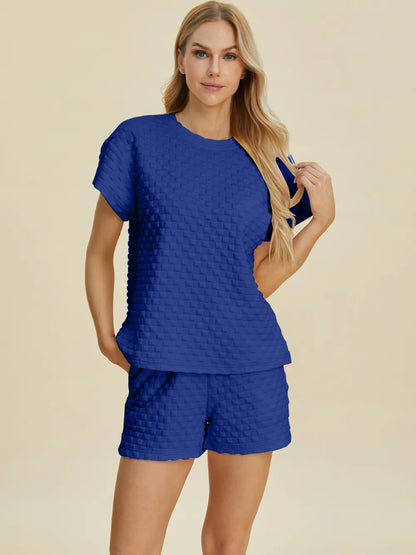 Pink Double Take full-size texture T-shirt and shorts set by Trendsi, featuring a comfortable fit and stylish design.