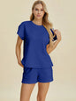 Pink Double Take full-size texture T-shirt and shorts set by Trendsi, featuring a comfortable fit and stylish design.