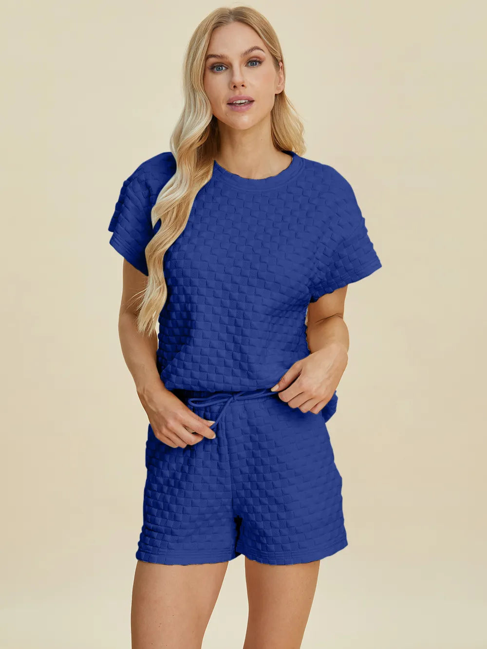 Pink double take full size texture T-shirt and shorts set by Trendsi, featuring a casual, stylish matching outfit for women.