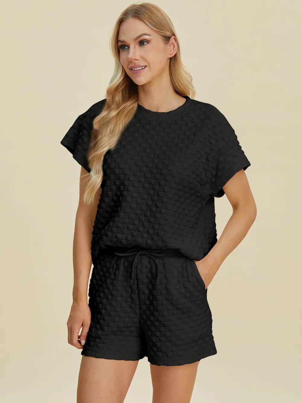 Pink double take full size texture t-shirt and shorts set by Trendsi, featuring a casual, comfortable look with textured fabric.