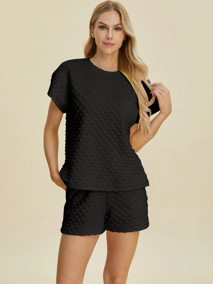 Pink double take full-size texture t-shirt and shorts set by Trendsi, casual matching outfit with textured fabric details.