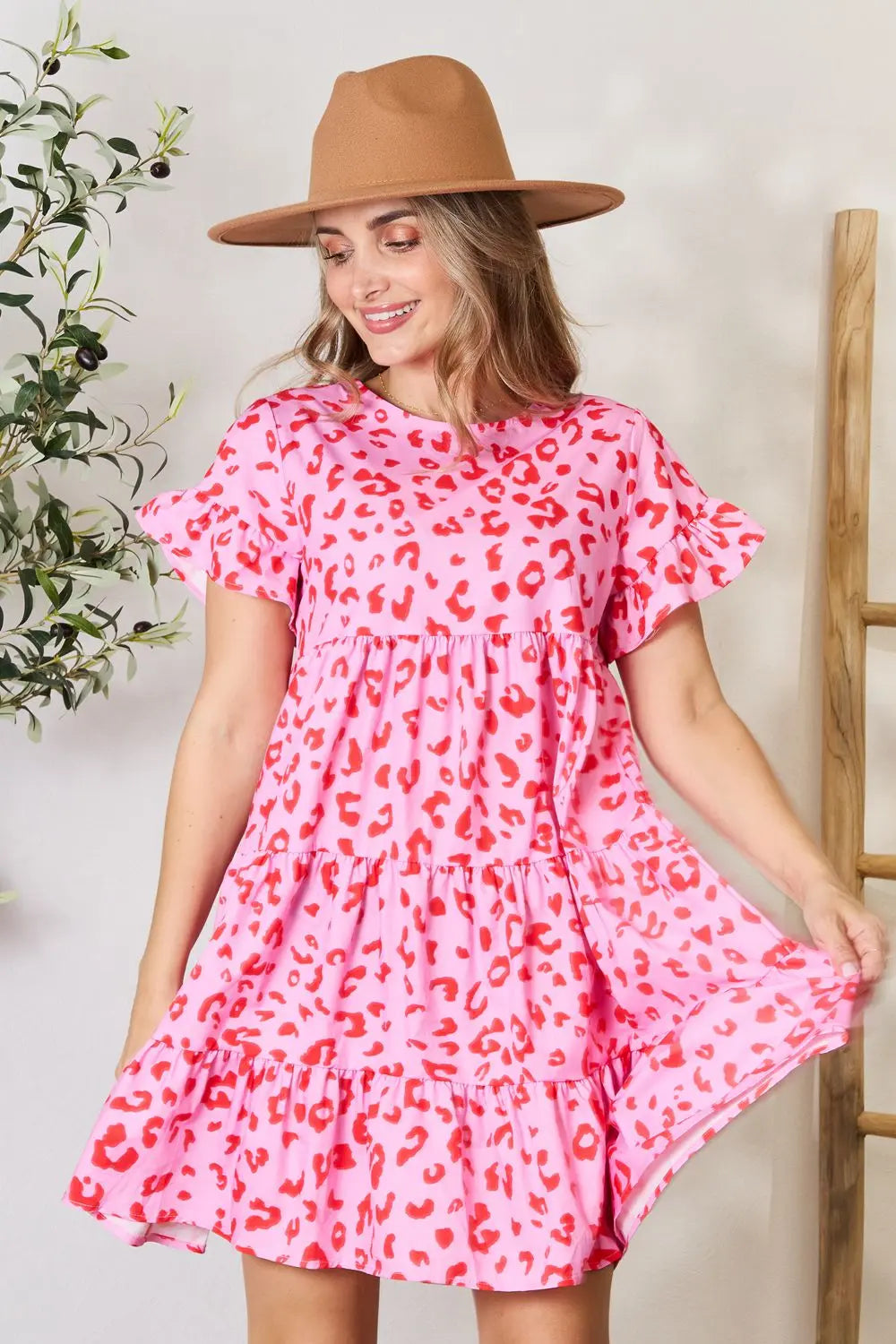 Pink double take short flounce sleeve tiered dress by Trendsi featuring layered fabric and a stylish, feminine silhouette.