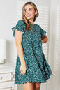 Pink double take short flounce sleeve tiered dress by Trendsi, showcasing layered fabric and flared sleeve details.