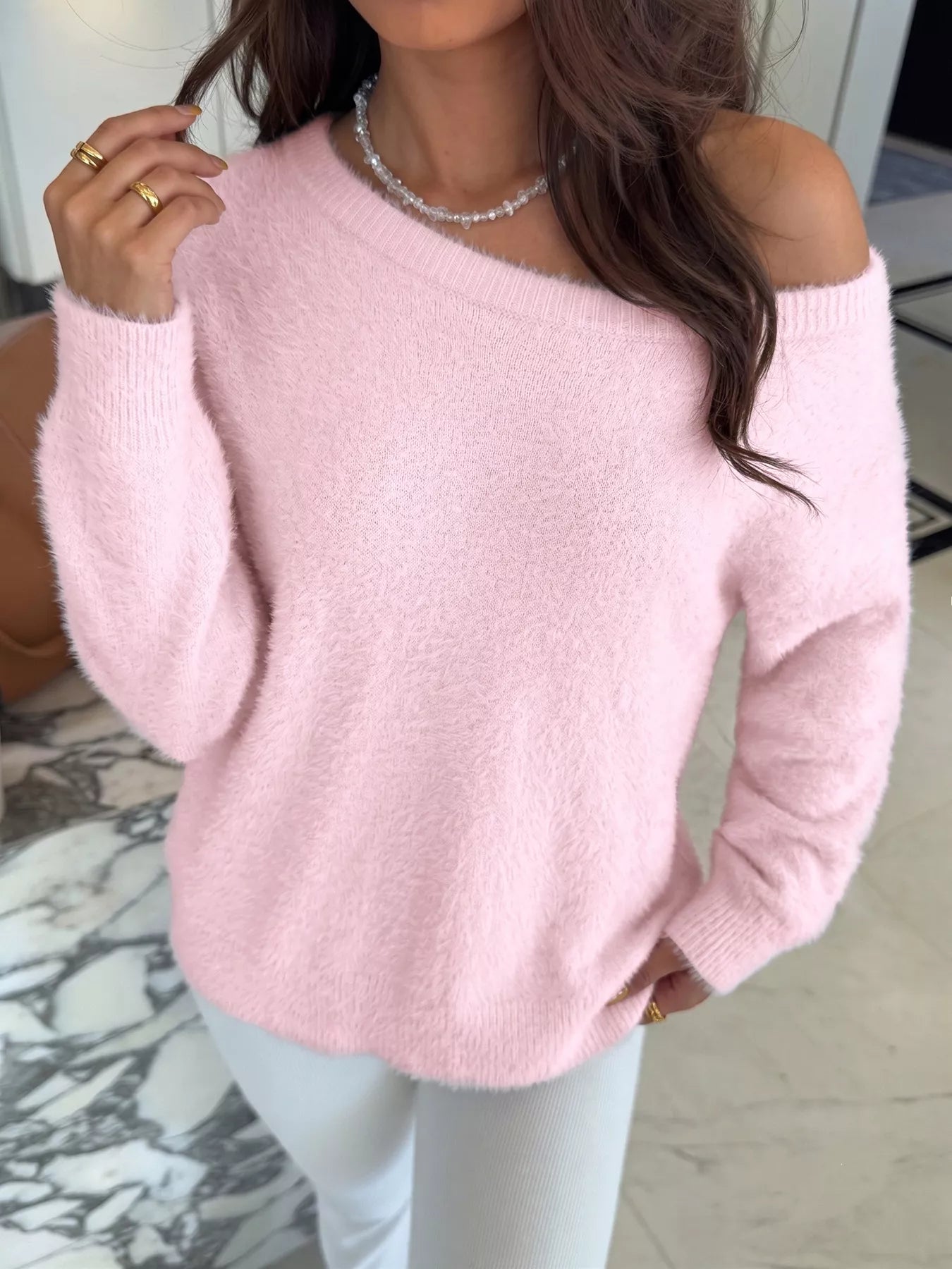 Pink fluffy long sleeve sweater by Trendsi, soft knit fabric with a cozy, relaxed fit, displayed on a neutral background.
