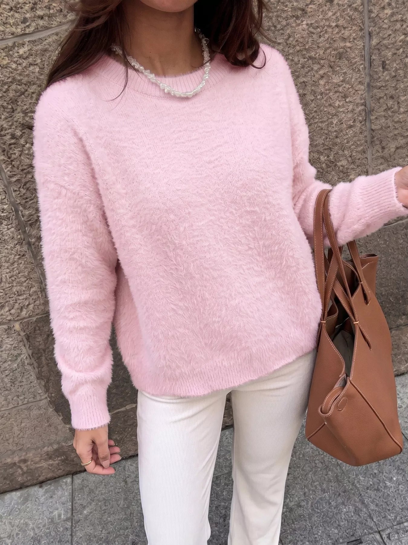 Pink fluffy long sleeve sweater by Trendsi, soft knit fabric with a cozy, relaxed fit, perfect for casual wear.