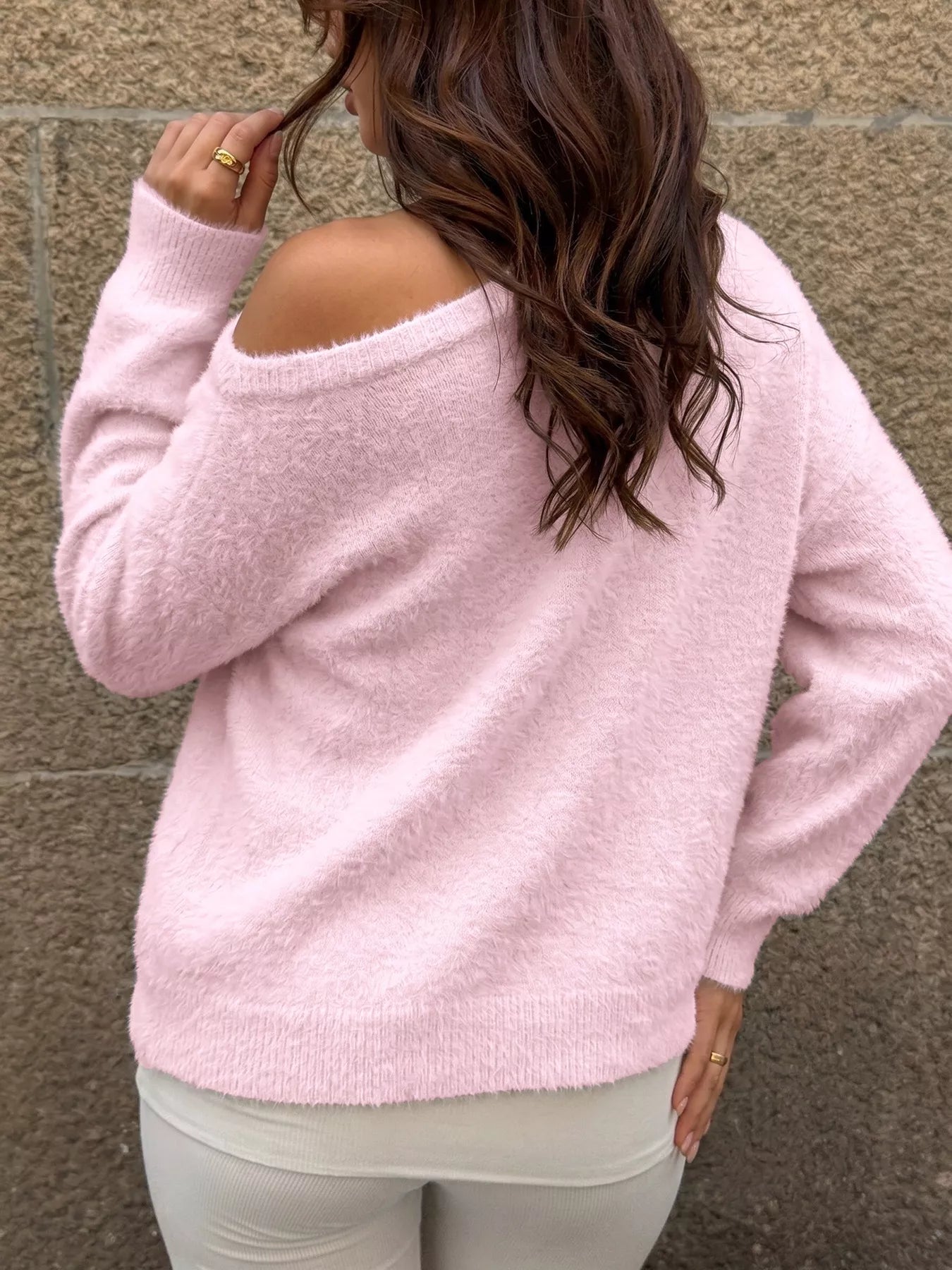 Pink fluffy long sleeve sweater from Trendsi featuring a cozy, textured knit for stylish comfort.