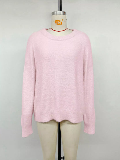 Pink fluffy long sleeve sweater from Trendsi, featuring a cozy, soft knit fabric and a relaxed fit.