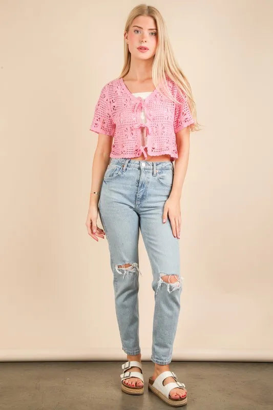 Pink Very J crochet crop top with front tie, short sleeves, and scalloped edges, perfect for casual summer wear.