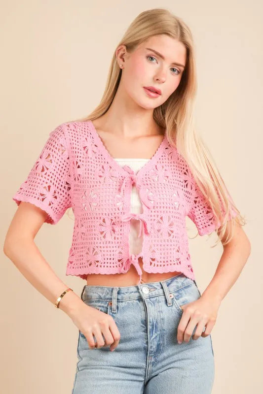 Pink Very J crochet crop top with front tie detail, short sleeves, and a fitted style, perfect for a casual summer look.