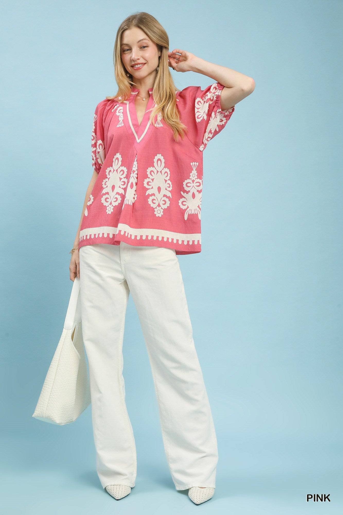 Pink Umgee boho print split-neck short sleeve top with relaxed fit and stylish design, perfect for casual wear.