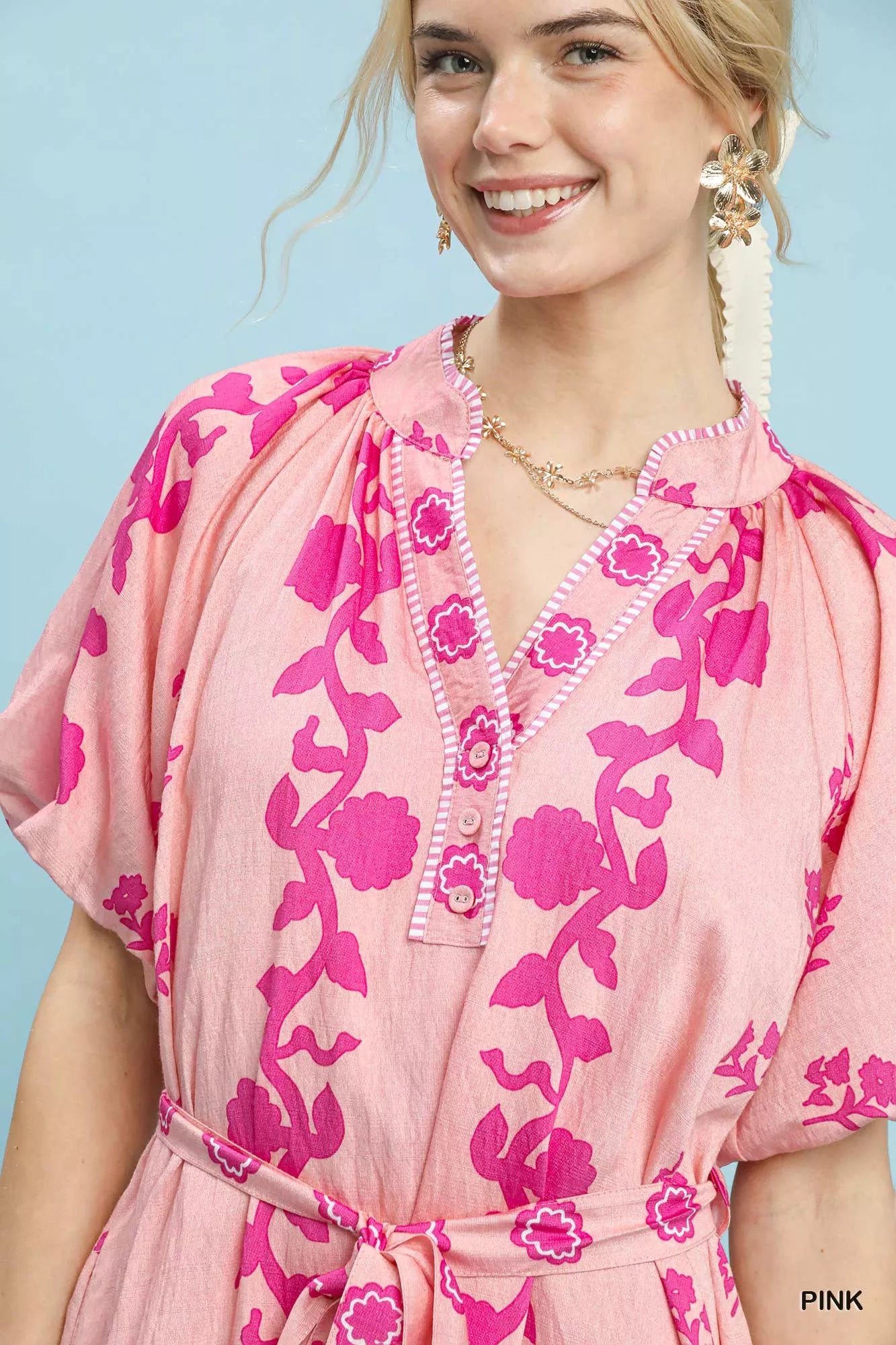 Pink Umgee floral tie-waist boho mini dress with a flowy silhouette and feminine floral print, perfect for casual summer wear.