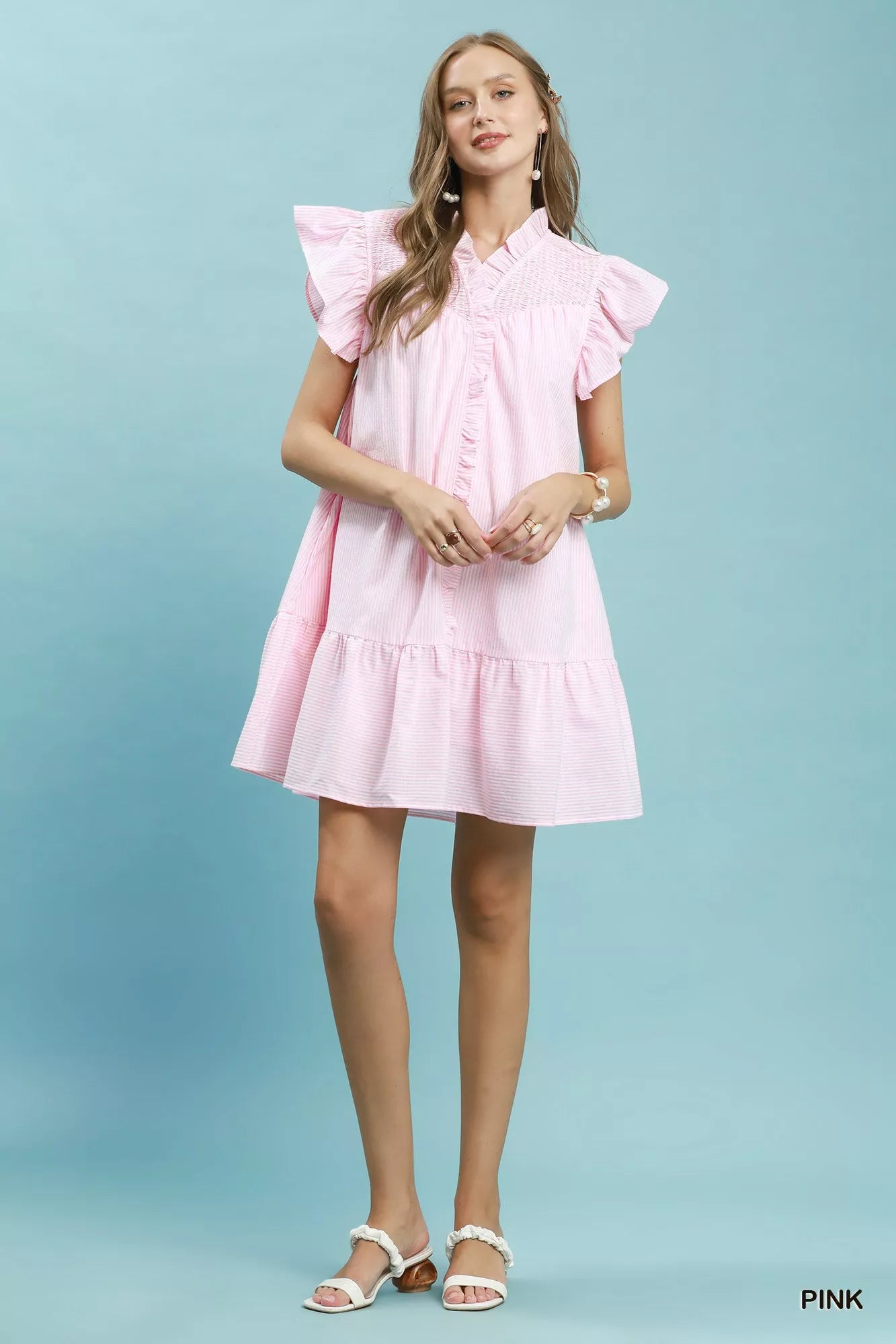 Pink Umgee stripe smocked yoke ruffle dress with short sleeves and a flowy silhouette, perfect for casual summer wear.