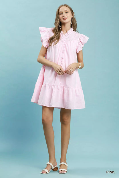 Pink Umgee stripe smocked yoke ruffle dress with short sleeves and a flowy silhouette, perfect for casual summer wear.