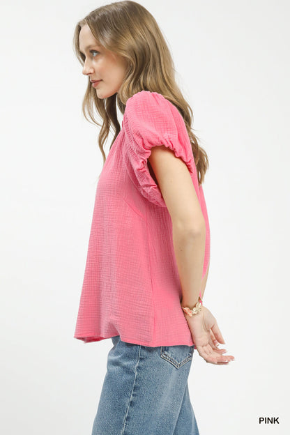 Pink Umgee boho top with textured gauze fabric and ruffle neck, featuring a relaxed fit and casual bohemian style.