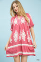 Pink Umgee two-tone border print mini dress with short sleeves, displayed on a hanger against a neutral background.