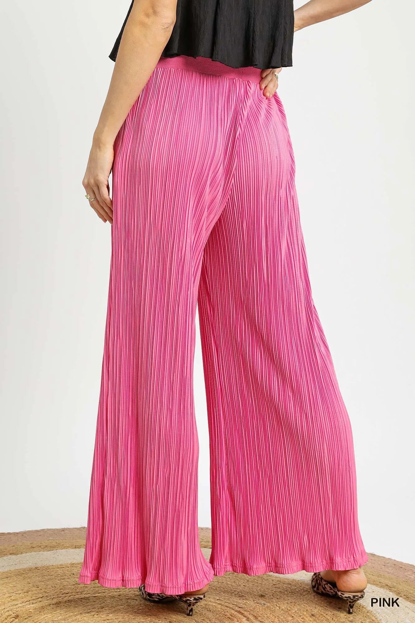 Pink Umgee wide-leg textured pants from Trendsi, featuring a relaxed fit and stylish design, perfect for casual or chic outfits.