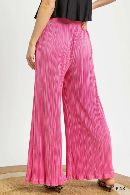 Pink Umgee wide-leg textured pants from Trendsi, featuring a relaxed fit and stylish design, perfect for casual or chic outfits.