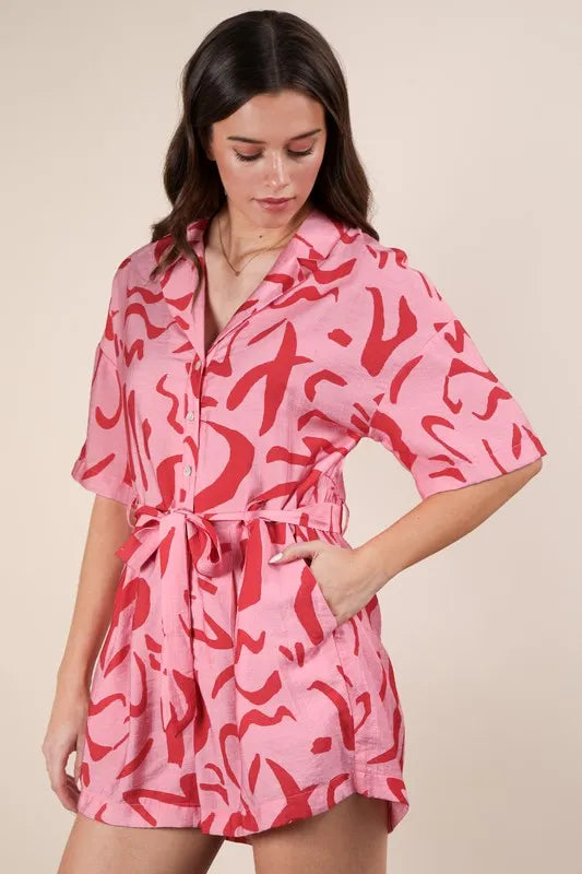 Pink oversized printed button-down resort romper by Very J featuring a relaxed fit and vibrant floral pattern.