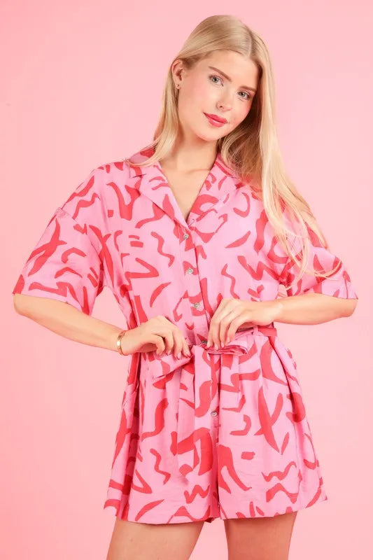 Pink oversized printed button-down resort romper by VERY J, styled for a relaxed, trendy summer look.