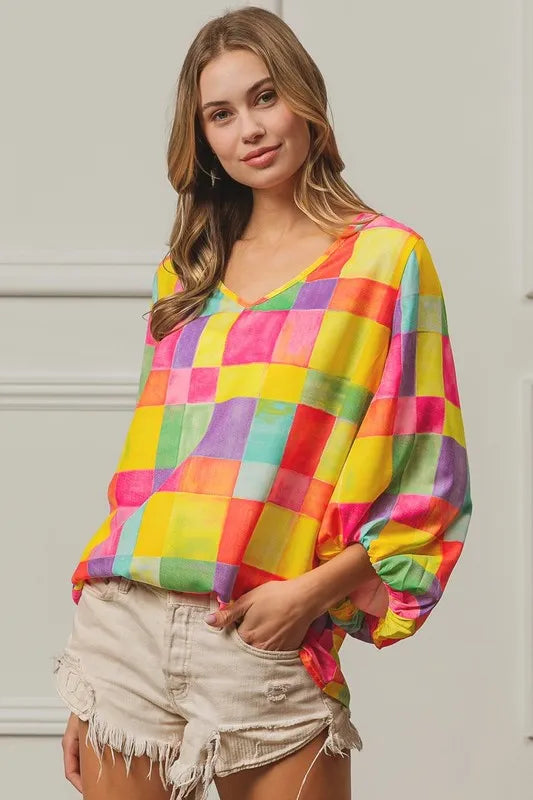 Pink, yellow, and blue BiBi Multi Block Bubble Pop Balloon Top by Trendsi, featuring colorful bubble details and a trendy style.