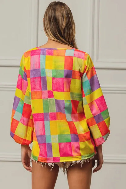 Pink, yellow, and blue BiBi Multi Block Bubble Pop Balloon Top by Trendsi, featuring colorful bubble print and a stylish cropped design.