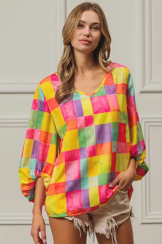 Pink, yellow, and blue BiBi Multi Block Bubble Pop Balloon Top by Trendsi, featuring vibrant, colorful bubble print design.