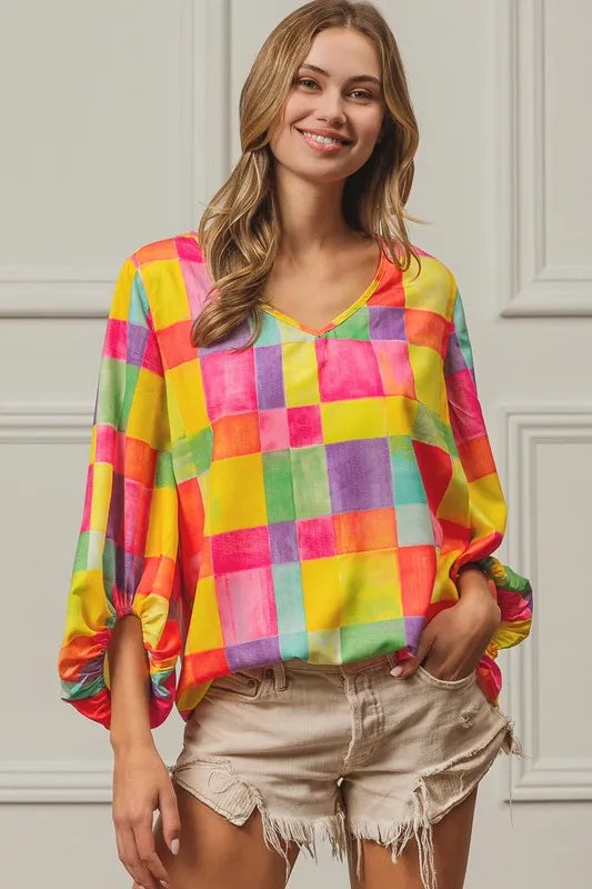 Pink, yellow, and blue BiBi Multi Block Bubble Pop Balloon Top by Trendsi, featuring colorful, playful fabric with bubble details.