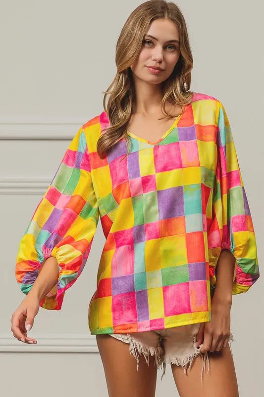 Pink, yellow, and blue BiBi Multi Block Bubble Pop Balloon Top by Trendsi, featuring colorful bubble pattern and playful design.
