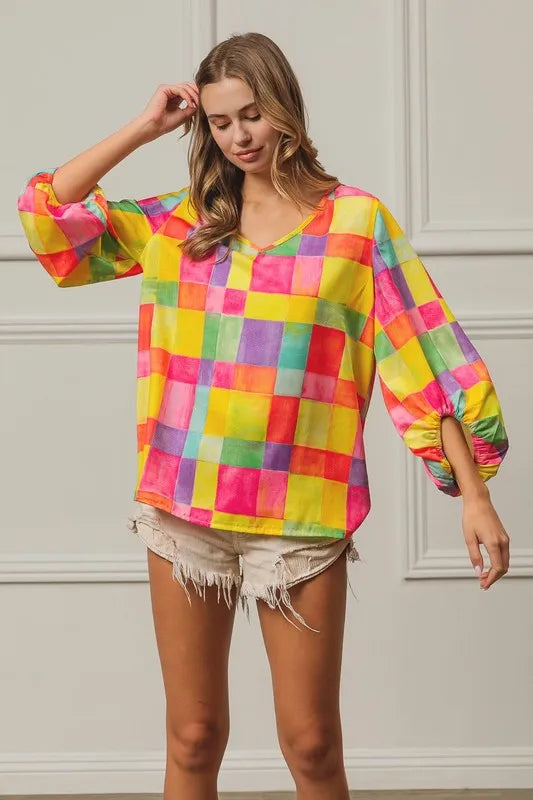 Pink, yellow, and blue BiBi Multi Block Bubble Pop Balloon Top by Trendsi, featuring colorful bubble pattern and casual fit.