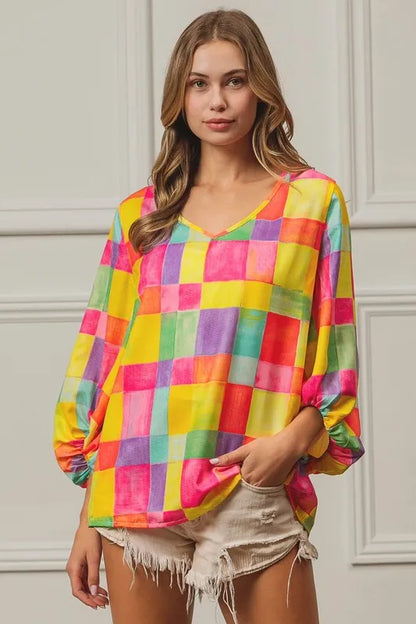 Pink, yellow, and blue BiBi Multi Block Bubble Pop Balloon Top by Trendsi, featuring colorful bubble designs and a playful style.